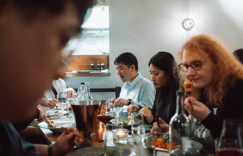 Punch Pizza team gathered around a table for a meal